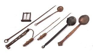 A copper ladle:, a copper and iron handled ladle, an iron ladle with single lipped bowl,