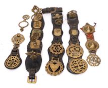 A Victorian leather horse collar: with various brasses attached,
