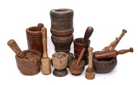 A turned wood urn-shaped mortar: with iron-banded base, 39cm high,