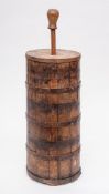 An iron coopered cylindrical butter churn: with cover and plunger, 45cm high.