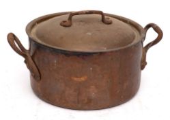 A copper drum-shaped twin-handled cooking pot:, 22.