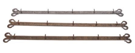 Three steel bar type hook racks: with scroll ends and damascened decoration, each with five hooks,