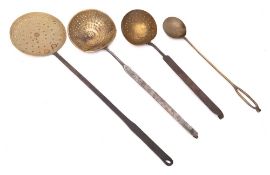 A brass skimmer: with circular pan and metal handle,