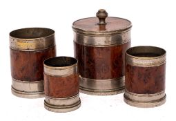 A graduated set of four burr yew-wood and metal mounted measures: with cover, 5.5cm - 8cm high.