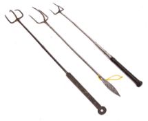 A steel three pronged flesh fork: with arrowhead terminal,
