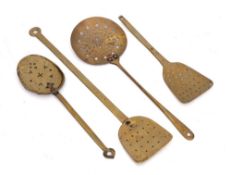 Two brass scummers: with beehive shaped blades,