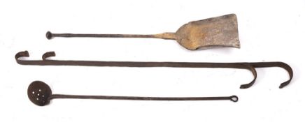 An iron scummer:, an iron shovel and an iron double ended hook, 18th/19th Century.