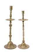 A tall brass candlestick: in the early 18th Century Dutch taste, with turned stem,