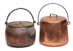 A 19th Century copper cauldron and cover: of tapering form with iron loop carrying handle,
