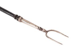 A silver twin pronged toasting fork: with ebonised turned handle, 61.5cm long, London 1894.