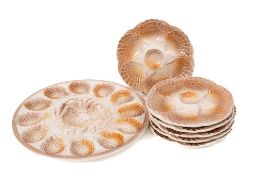 A Sarreguemines brown and cream glazed oyster set: with circular serving dish,