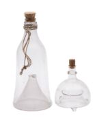An unusual glass gudgeon trap:, of bell shape with cork stopper, 36cm high,