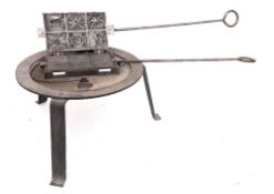 A 19th Century waffle iron:,