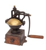 A French cast iron and brass coffee grinder: with wood drawer,