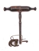 An unusual 19th Century tooth pull: with turned wood handle, steel shaft and five various hooks.