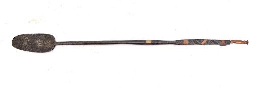 A rare iron cauldron scraper:, the handle inlaid with copper and brass,