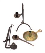 A wrought iron rushlight holder: with hinged candle sconce on tripod base, 26cm high,