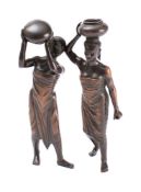 Two Burmese bronze figures: of Pegu female water carriers: each 17cm high.