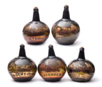 A set of five large 19th century green glass pharmacy bottles/carboys: decorated in red and gilt