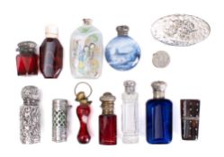 A collection of silver and gilt metal mounted scent bottles,
