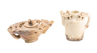 A Chinese carved soapstone pot and cover: of oval outline with foliate decoration, 15cm long,