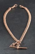 A 9ct gold curb-link watch chain,: with T-bar and two dog clips, partial hallmarks for Birmingham,
