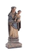 A Continental carved wood and polychrome decorated figure of the Madonna and Child: mounted on a