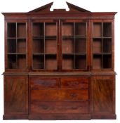 A mahogany and glazed breakfront library bookcase in George III style,