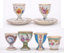 A group of six Continental and other egg cups: including a Sevres-style cup painted with pendant
