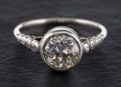 A round, brilliant-cut diamond, single stone ring,: estimated diamond weight ca. 1.