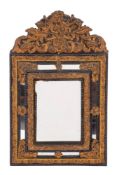 A Dutch ebonised wood and gilt repousse metal mounted wall mirror in 17th century style,