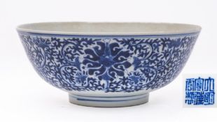 A Chinese blue and white 'lotus' bowl: the exterior painted with flowering lotus amongst scrolling