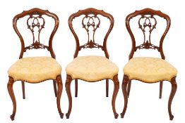 A set of four Victorian walnut and upholstered salon chairs, circa 1875,