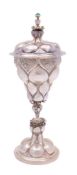 A 19th century German silver goblet and cover: of pineapple design, the lobed,
