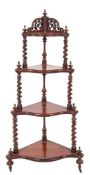 A Victorian carved rosewood corner whatnot, circa 1860,