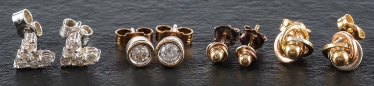 Four pairs of ear studs,: a pair of 18ct white gold chevron ear studs,