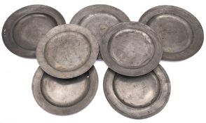 A collection of seven 18th century and later pewter chargers: diameters from 43cm to 40cm (7)