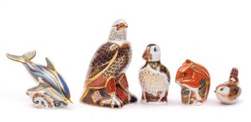 Five Royal Crown Derby paperweights: comprising a Bald Eagle, Puffin, Striped Dolphin,