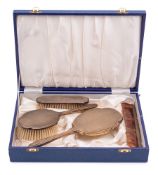 An Elizabeth II four-piece dressing table set, maker AC, Birmingham, 1976: includes, hand mirror,