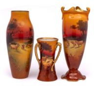 Three Royal Doulton vases: one of compressed slender oviform with asymmetric foot and rim and
