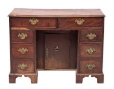 A George II mahogany kneehole desk, circa 1740,