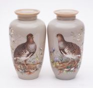 A pair of late 19th/early 20th century opaque glass vases: each enamelled with a vignette of a