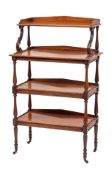 A George IV mahogany four tier whatnot, circa 1825,