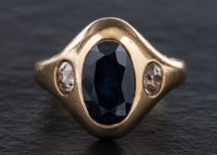 A sapphire and old-cut diamond three-stone ring,: estimated total diamond weight ca. 0.