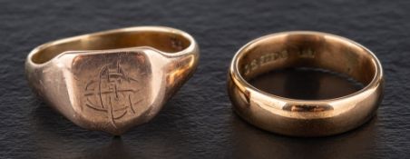 Two rings,: a signet ring with indistinct monogram, stamped '9CT', length of ring head ca.