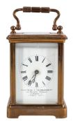 A small French Edwardian brass carriage clock: the eight-day duration timepiece movement having a