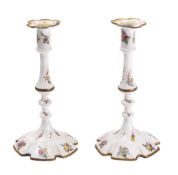 A pair of 19th century South Staffordshire enamel candlesticks: the cylindrical sconces with
