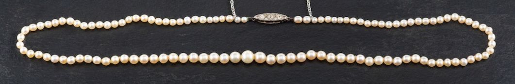 A graduated, single row, pearl necklace to an old-cut diamond clasp,
