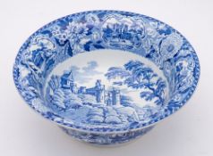 A Minton pottery wash bowl: of circular form with everted rim transfer printed in blue in the