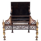 A 19th Century fire basket in the Adam style: the rectangular basket supported on swept brass front